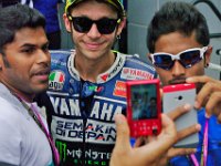 Sunday 13 October 2013 - Race day  One of the reasons Rossi is so popular is that he realises who pays the money that pays his wages. He tolerantly smiles while a couple of Malaysians take selfies. : Sepang