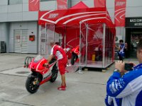 Sunday 13 October 2013 - Race day  Putting the twin-seat Ducatis back on display after the customer rides are over. : Sepang