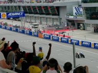 Sunday 13 October 2013 - Race day  Luis Salom gets the checkered flag in first place. Alex Rins and Miguel Olivera take the next two places. : Sepang