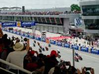 Sunday 13 October 2013 - Race day  Thirty four Moto2 bikes scramble for position. : Sepang