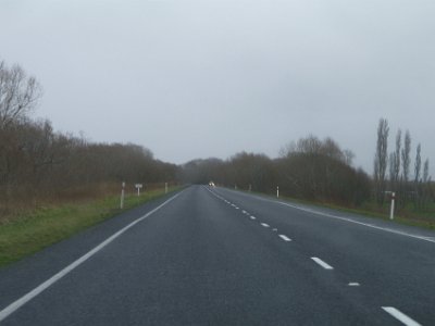 Day 3 - 40th Anniversary trip to NZ  We're on our way to Invercargill and just south of Dunedin we pull off the motorway and fill the car.  It seems to be very economical and it takes only 28 litres. According to a nearby electronic sign, the temperature is 9.6° and it's raining. We drive into heavy rain on our way south.