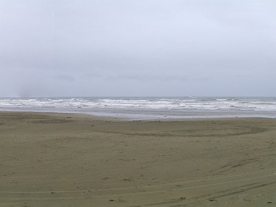 Day 4 - 40th Anniversary trip to NZ  The first thing we do this morning is to visit Oreti Beach hoping that it might be a little less violent than last night. The wind has calmed slightly and this time we can stand up in it quite easily.