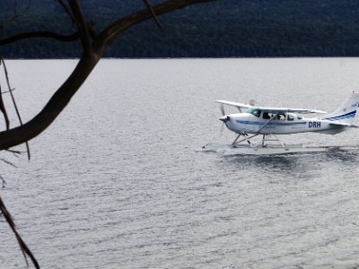 Day 4 - 40th Anniversary trip to NZ  A seaplane is moored on the lake and, a few minutes later, it takes off and heads into Fiordland.