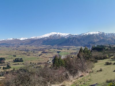 Day 6 - 40th Anniversary trip to NZ  We leave Arrowtown and drive to Arrow Junction. Here we have the opportunity to take a very minor road to Wanaka, another of NZ's famous tourist spots. We take the exit to Wanaka and drive up a very steep hill and get out to enjoy the view. I start thinking that if the rest of the trip to Wanaka is like this, our old rental car might not make it. Jenni wants to continue but I throw myself on the ground and scream until she agrees to turn back.