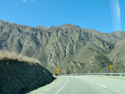 Day 6 - 40th Anniversary trip to NZ  We drive a short distance east towards Cromwell and pass several vineyards. Then we go through the Karawati Gorge. What I like about this is its rugged mountains and cliffs totally devoid of sheep, cattle, pine trees, gorse and poplars.