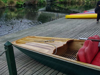 Day 8 - 40th Anniversary trip to NZ -  Punting on the Avon   After a short wait, they slide the punt out of the boat shed. A punt is a flat-bottomed boat with a square-cut bow, designed for use in shallow water.