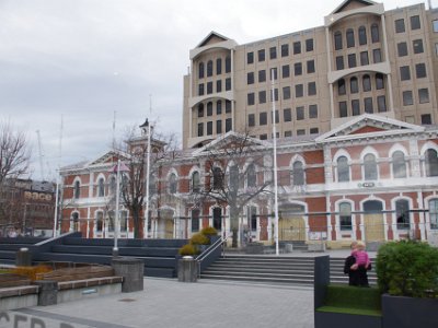 Day 8 - 40th Anniversary trip to NZ -  Jenni explores the city area   This is the Christchurch Central Post Office building  located in Cathedral Square. The building was initially a post office with other government services. Until the 2011 Christchurch earthquake, it was a Visitor Information Centre but has since been inaccessible. It was the site of the first telephone exchange in NZ and is registered with the NZ Historic Places Trust as a Category I heritage building.