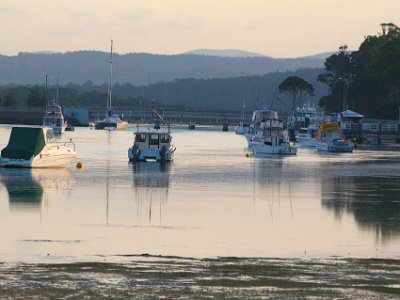 TEL 1839-1     SATURDAY Into Merimbula  The Sapphire Coast Drive crosses the bridge in the background and continues on to Pambula and Eden.