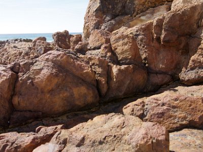 SUNDAY Bournda Beach  Not that I would lay money on it, but the rocks appear to be metamorphic.  That is, created in layers on the earth's surface, subducted back into the mantle and then pushed back to the surface again.  As Darwin realised, these processes take a very long time.