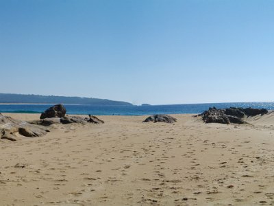 TUESDAY North Tura Beach  The sea isn't really bent; it's the result of stitching two pictures together. Given that, this is still a great view of the sand bridge to Bournda Island.