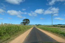 We head for Mt Hypipamee and, on the way, we travel over a single-track strip of bitumen down the centre with dirt edges. A large number of Queensland roads were like this years ago and it means that both vehicles have to head for the dirt to pass each other.