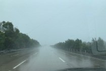 On the M1 going south, a fierce rain storm develops which buffets our large and heavy car around.