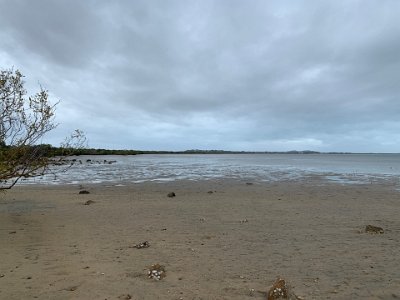 Not so glamorous when the tide is out. The beach appears to be a mixture of sand and mud.