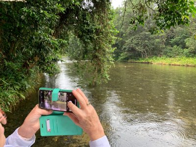 Jenni takes a picture of the widening stream.