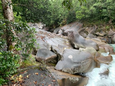 The boulders are granite and have worn smooth over the countless years the flowing water has polished them.