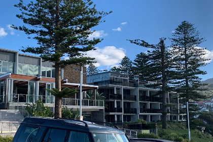 Monday 25 July 2022 I lie on the bed and rest my eyes. While I do so, Jenni goes for a wander around the hotel. Our room is in the building on the right.