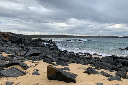 Saturday 28 May, 2022 - Bingie Bingie These huge black rocks appear on the small beach on the Northern side of the Point.