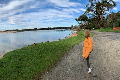 Sunday 29 May, 2022 - North Durras Jenni walks into my picture as I take a panorama shot with my iPhone.