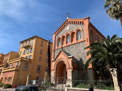 Thursday, 16 March 2023 I waited for La Navette to take me to the gare right near this attractive church.  The name Eglise Evangelique Francaise is carved over the entrance; the Protestant church was founded in 1857 by Jean-Marie Trenca, a relative of the family with connections in Menton (an area in the town is called Trenca).