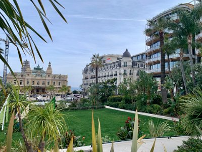 Tuesday, 7 March 2023 Monte Carlo, Monaco. Sussie attends a work function & I do some sightseeing.  Monte Carlo Casino & Hotel de Paris on the right viewed from Les Jardins de La Petite Afrique.