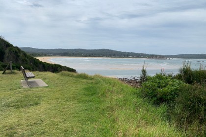 Wednesday 06, March 2024 A better look at Tomakin Beach from Mossy Point.  Good grief; there are surfers in the water and there are people on the beach.