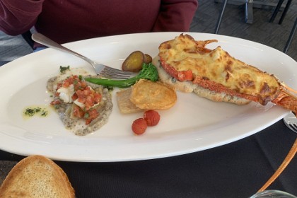 Sunday, 5th July 2025 One half of my lobster is hidden under the tomato relish and the other half rests on a bed of potato mash.