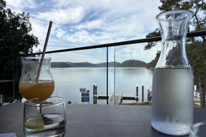 Sunday, 5th July 2025  this is an interesting view from our table of the Hawkesbury River. The orange juice is mine. I still don't touch alcohol (because lips that touch alcohol shall never touch mine).
