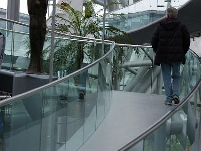 Tuesday 11  April, 2006   Claus walks up the glass-encased footway . . .