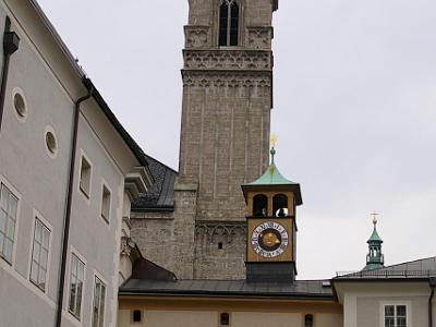 Monday 10  April, 2006   We then drive from the train station to old Salzburg and park the car in a parking station buried in the mountain. The tower in the background belongs to the Franciscan Church which was built built in the 13th century