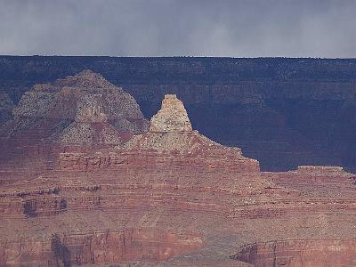 GRAND CANYON.  Sun shining in foreground, rain falling in background.