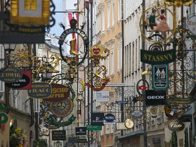 Monday 10  April, 2006   It is the law in Salzburg to designate shops by hanging iron signs over them. This makes Getreidegasse, the main pedestrian street through old Salzburg, quite unique.