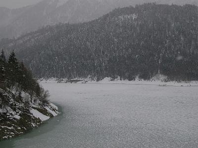 Wednesday 12  April, 2006   We wind our way through a pass in the Alps and cross from Austria back into Germany. We get to a frozen lake called Lake Sylvenstein where we stop.