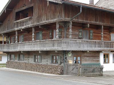 Friday 14 April, 2006  Another feature of Bavarian houses, where they use wood as a fuel, is that the wood piles are unbelievably accurate. It's as though they were cut to length using a laser. Note that the rear of this building is brick.