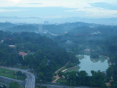 Sunday 16  April, 2006  Our room is on the 27th floor and Taman Tasik Perdana park is below us. It was built in the 1880's and measures 104 hectares. The Malaysian Houses of Parliament  building is visible diagonally up from the lake.