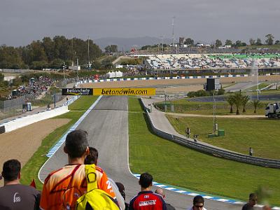 Saturday 25 March, 2006  Turn 10 Curva Peluqui looking down to our seating location to the left of the betandwin.com sign. Not too crowded right now.