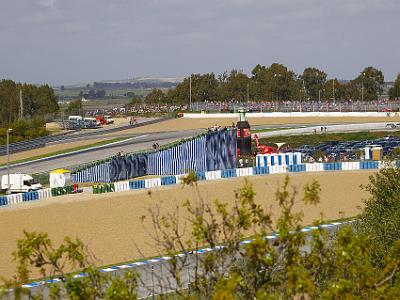 Saturday 25 March, 2006  The first turn exiting the main straight, Curva Expo 92 is visible across the centre of the picture. On the left, you can see where the riders leave the pit area to join the track.