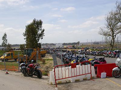 Saturday 25 March, 2006  The bikes would go around the cars on the freeway and park on the streets going to the circuit. That's a Police bike on the right.