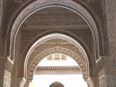 Sunday 2 April, 2006  A series of arches looking out to the Court of the Myrtles from within the Hall of the Ambassadors. The Islamic inscriptions say something about there being no winner but God.