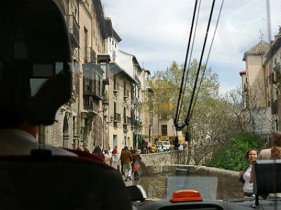 Saturday 1 April, 2006  In the bus navigating the narrow streets of the Albaicin. The old bridge in front crosses the Rio Darro.