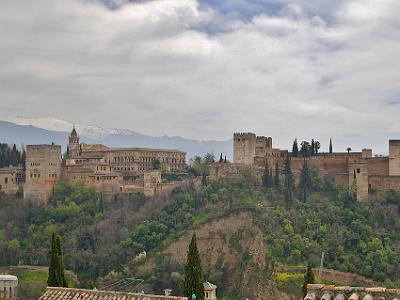 Saturday 1 April, 2006  The Alcazabar or fort is to the far right of the picture. The Tower of Comares is in the middle of the older buildings to the left. These are the Nazaries Palaces, the original palaces of the sultans of Granada. The huge cutting in front is where the material used in the construction of the Alcazaba was removed; called the Alhambra conglomerate.