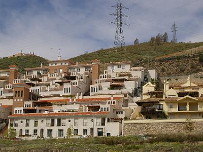 Saturday 1 April, 2006  Modern apartments built into the hillside. What's interesting is the Moorish-style arches.