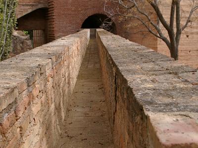 Sunday 2 April, 2006  The original walls were used to channel water from the Rio Darro throughout the complex. The brickwork is probably relatively modern. The Alhambra had two aqueducts: one for the normal channeling of water to the complex and another to handle overflow during times of flooding.