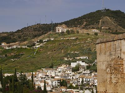 Sunday 2 April, 2006  At the top of the hill is the Palacio de Dar-al-Horra. The mother of the last sultan of Grenada, Boabdil, lived here. The Murallas del Albayzin (Moorish defensive walls) can be seen to the left going up to the palace.