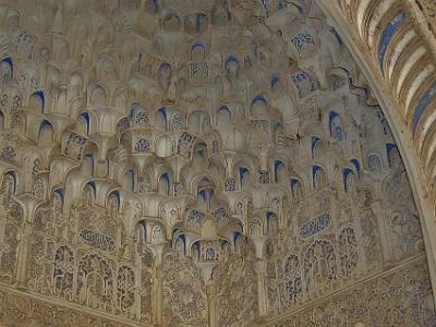 Sunday 2 April, 2006  In the entrance to the Court of the Myrtles. This is called mocarabe (Spanish for honeycomb) vaulting and is a complex geometric pattern, conforming to mathematical rules, and made of plaster. The blue was originally mined in Afghanistan and was said to be more valuable than gold.