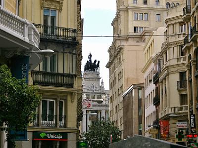 Friday 7 April, 2006  It seems that up every little alley is an impressive monument or building. This is one of a pair of quadrigas that sit atop the Communidad de Madrid Building two streets over in Calle de Alcalá