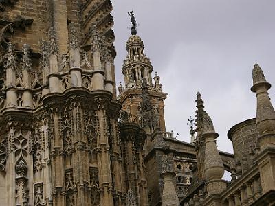 Thursday 23 March, 2006  The intricacy of the stone work is amazing. That's the Giralda in the centre background. This also remains from the original muslim structure although it was later added to.