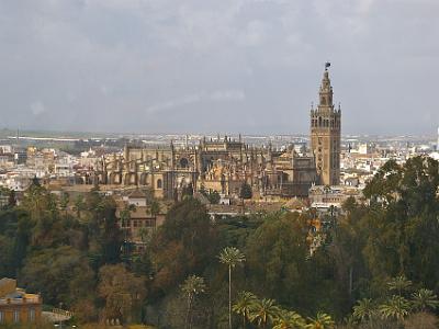 Friday 24 March, 2006  The Cathedral and Giralda are stunning from up here. The gardens of the Alcazar are in the foreground.