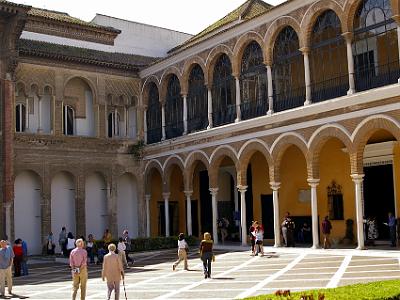 Sunday 26 March, 2006  Most of the modern Alcázar was built over Moorish ruins for King Pedro of Castile (also known as Pedro the Cruel) with construction beginning in 1364.  This is the Patio de la Montería (patio of the hunt) with King Don Pedro's Palace to the left.