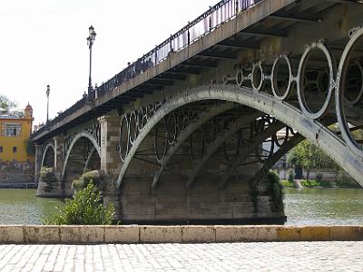 Sunday 26 March, 2006  The Triana Bridge was built by the French engineers Steinacher and Bernadet with architectural similarities to the Carroussel Bridge in Paris.