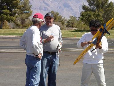 Saturday 18, 2006  Final day of flying. It was extremely windy but I managed to get through it OK. Here, I'm laughing about it with Lou Wolgast while Masaru looks after my plane.